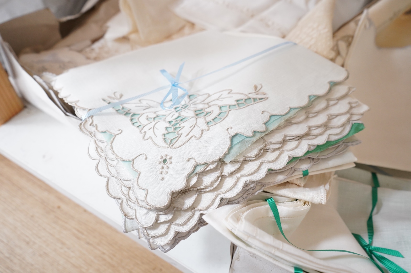 A collection of mixed damask embroidered and cutworked table cloths, napkin sets, hand towels and mats (in 3 boxes)
